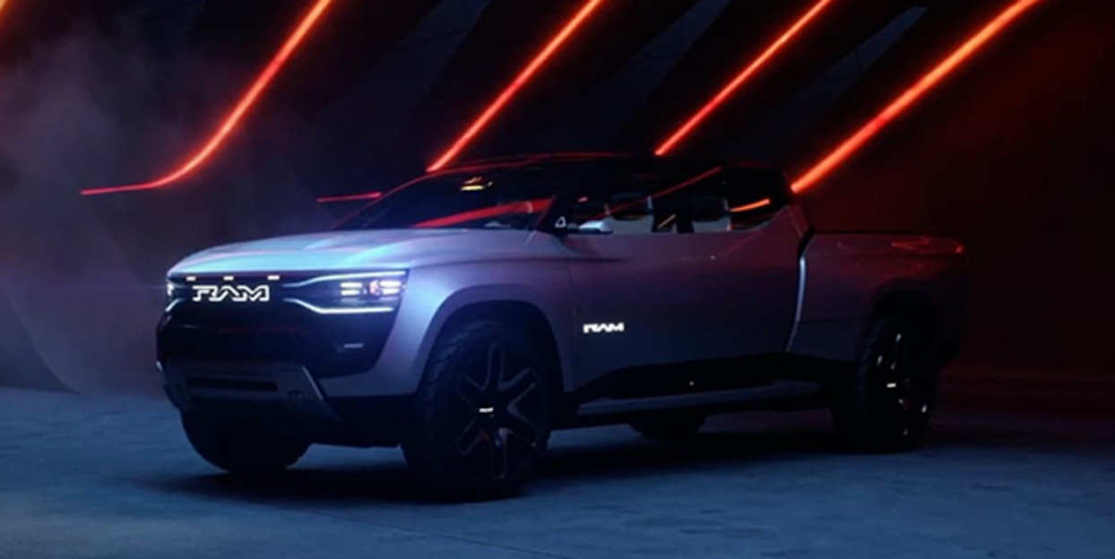 Side view of a 2023 Ram Revolution Concept truck driving. EXPLORE THE RAM REVOLUTION