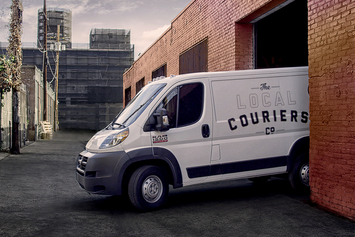 White Ram ProMaster Turning Onto a Side Street
