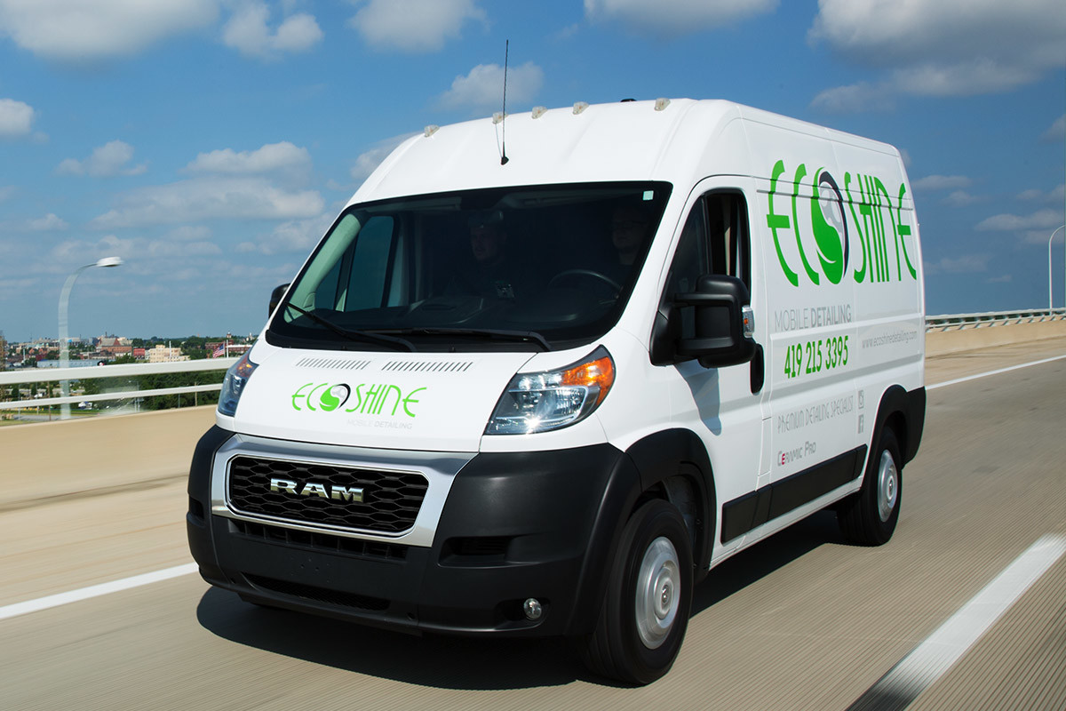 The 2020 Ram ProMaster being driven on a road in an urban area