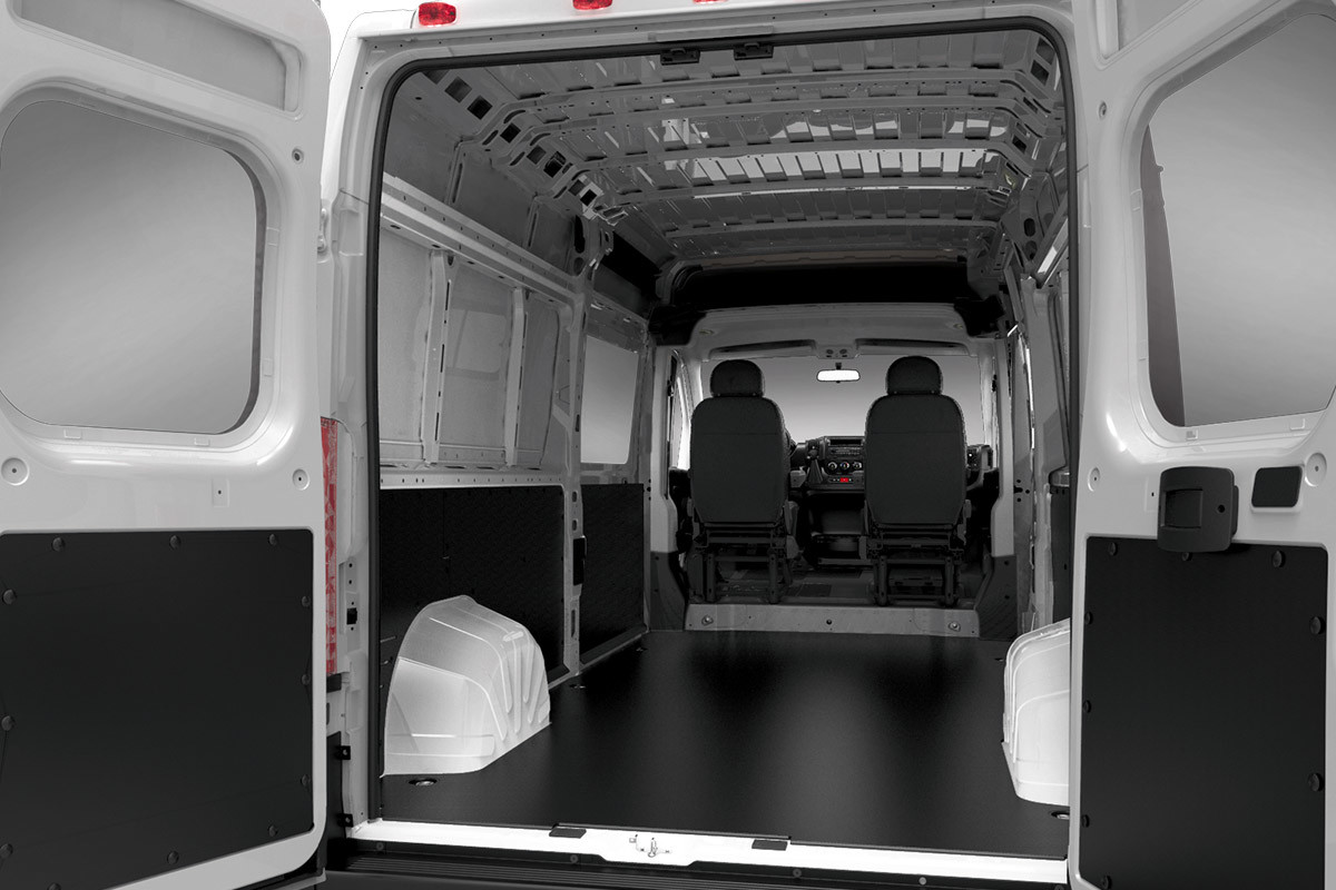 Ram ProMaster with the back doors open, revealing an empty interior cargo space.