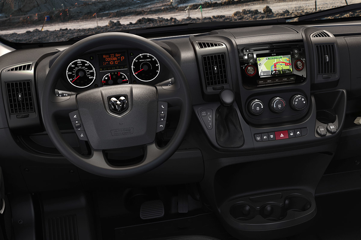 Interior shot of the steering wheel and controls from the driver’s seat perspective.