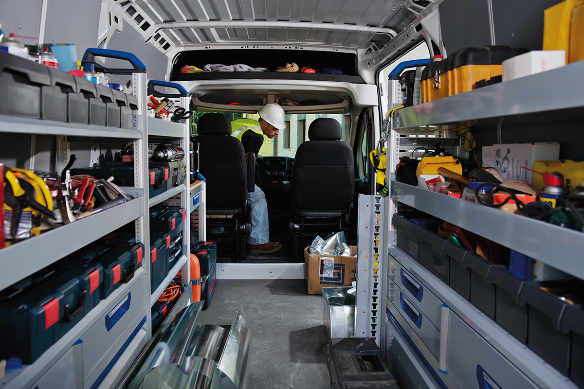 Interior shot of the Ram ProMaster displaying custom shelving stocked with construction equipment.