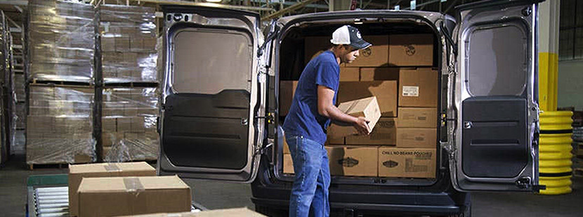 2019 Ram ProMaster City being unloaded in a commercial garage, shown in grey