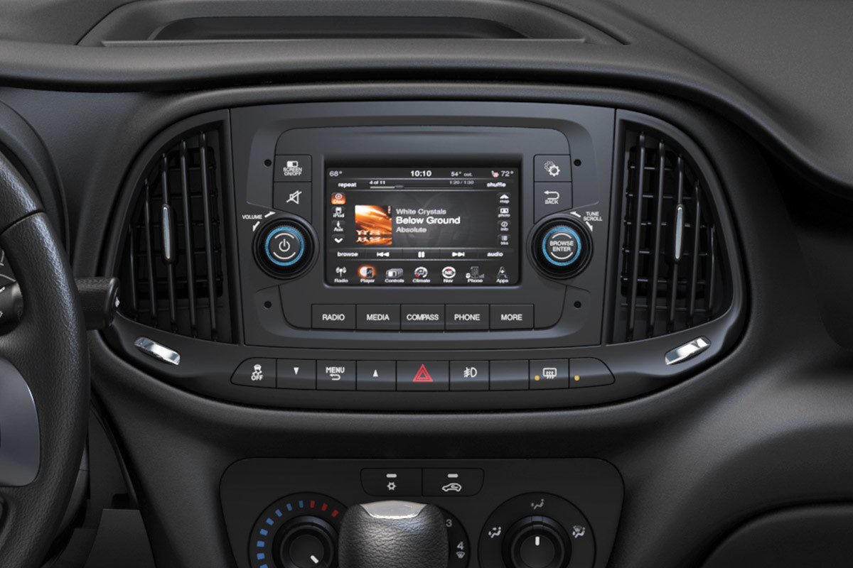 Close-up view of the steering wheel, gear shift and touchscreen in the 2022 Ram ProMaster City.