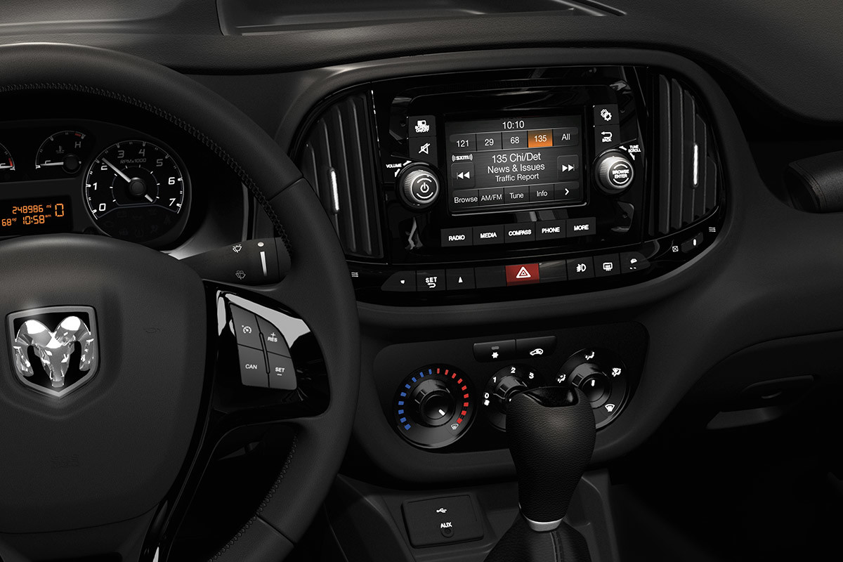 Close-up view of the steering wheel and touchscreen in the 2022 Ram ProMaster City.