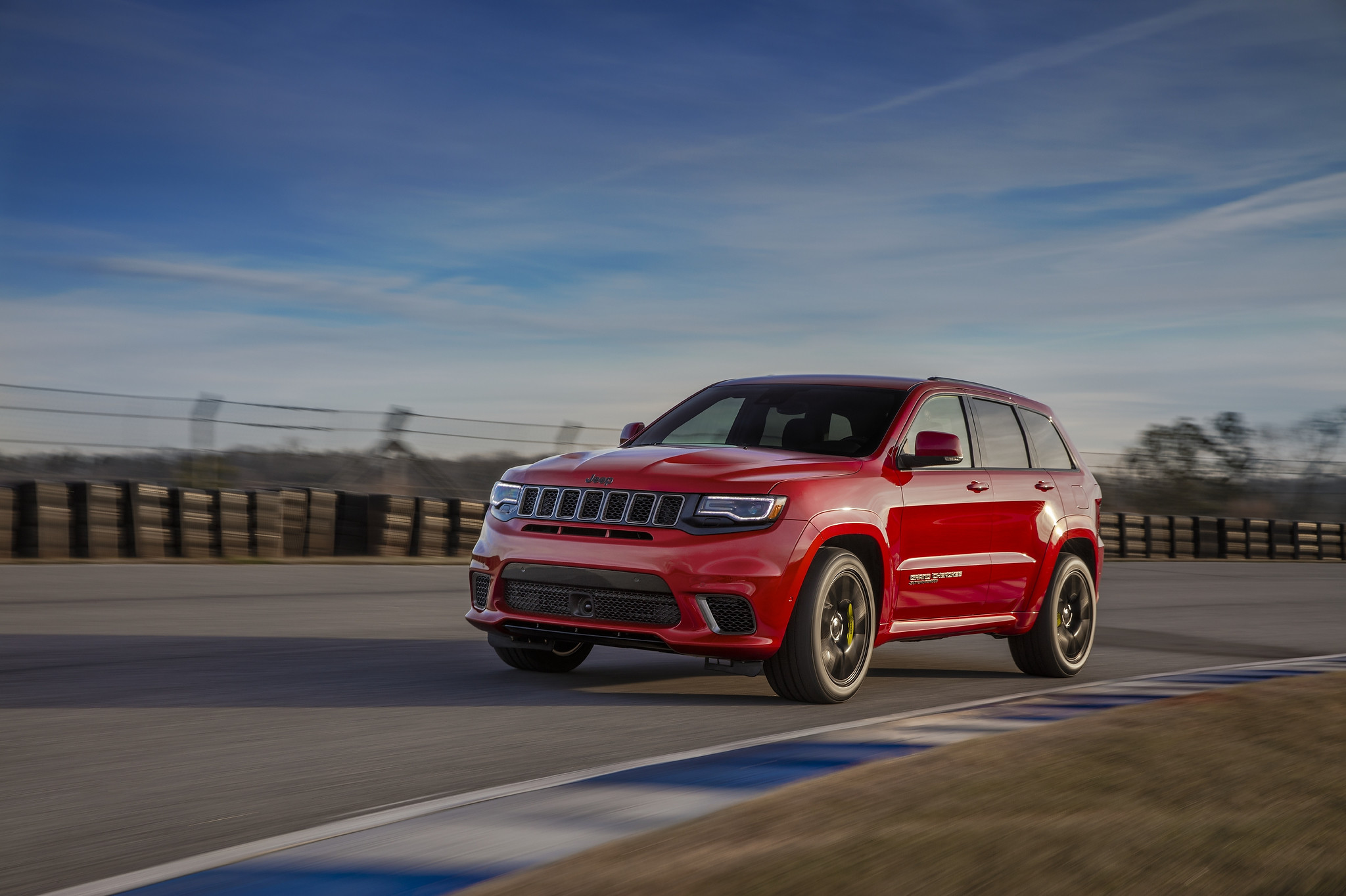 A 2021 Jeep Grand Cherokee Supercharged taking a turn on a racetrack