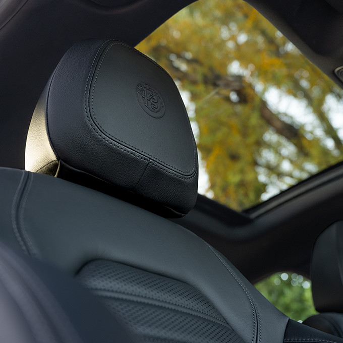 A close up of a black leather passenger seat of a 2023 Alfa Romeo Giulia.