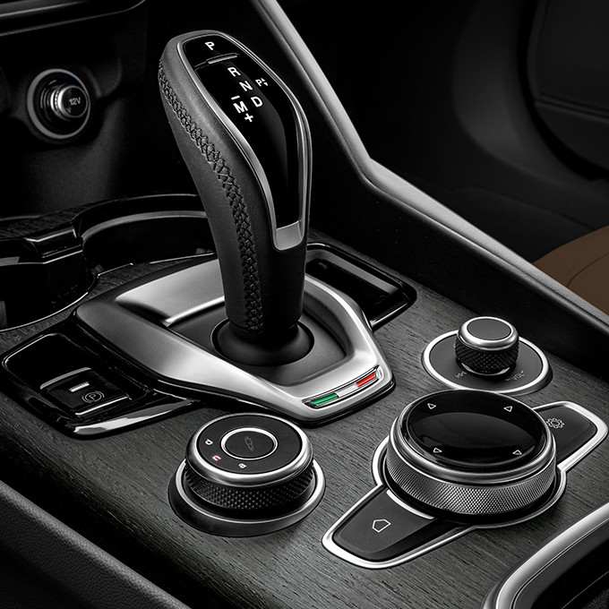 A closeup of the center controls of a 2023 Alfa Romeo Giulia.