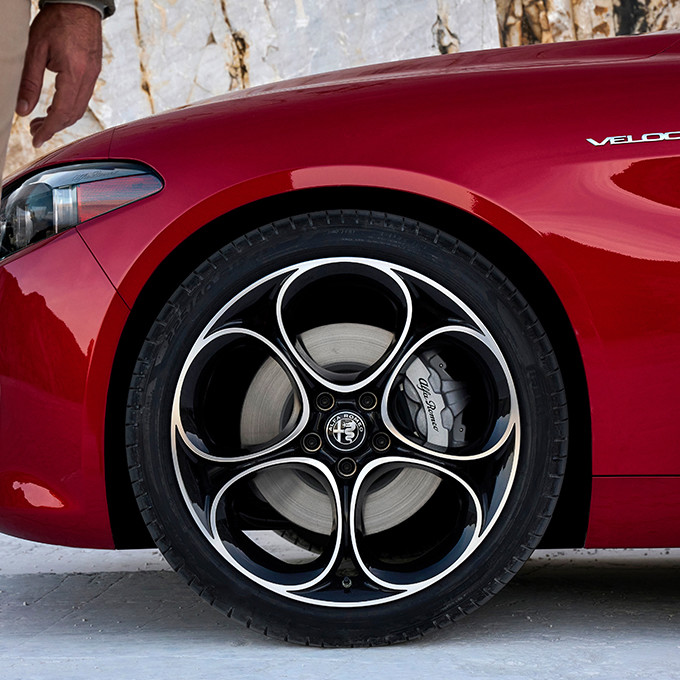 A close-up view of the wheel, tire and rim option on a 2024 Alfa Romeo Giulia.