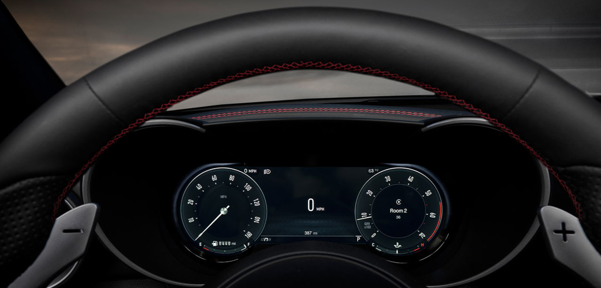 Interior view of the 2025 Alfa Romeo Giulia showcasing the digital cluster display behind the steering wheel.