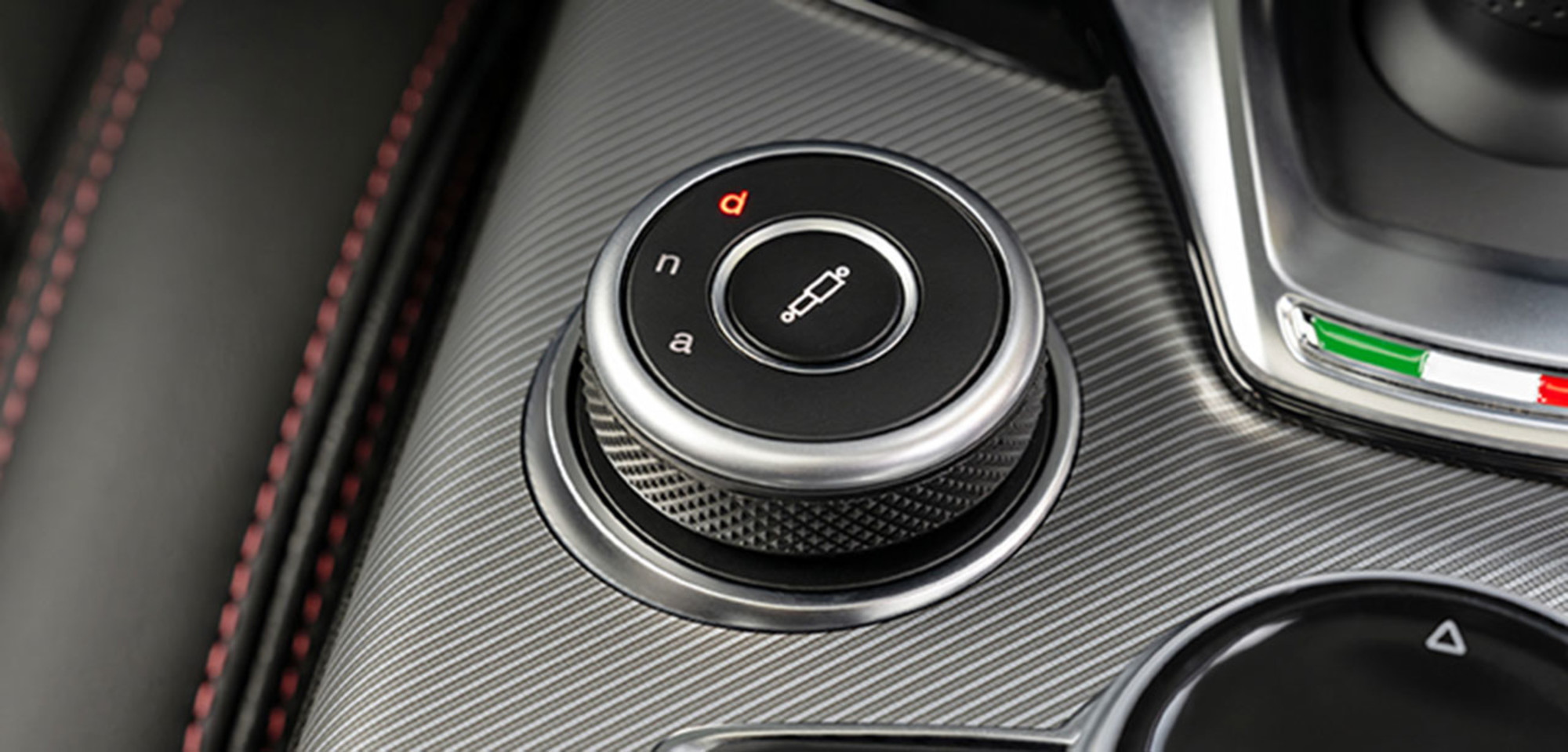 Close-up of control dial in the 2026 Alfa Romeo Giulia interior, showcasing details.