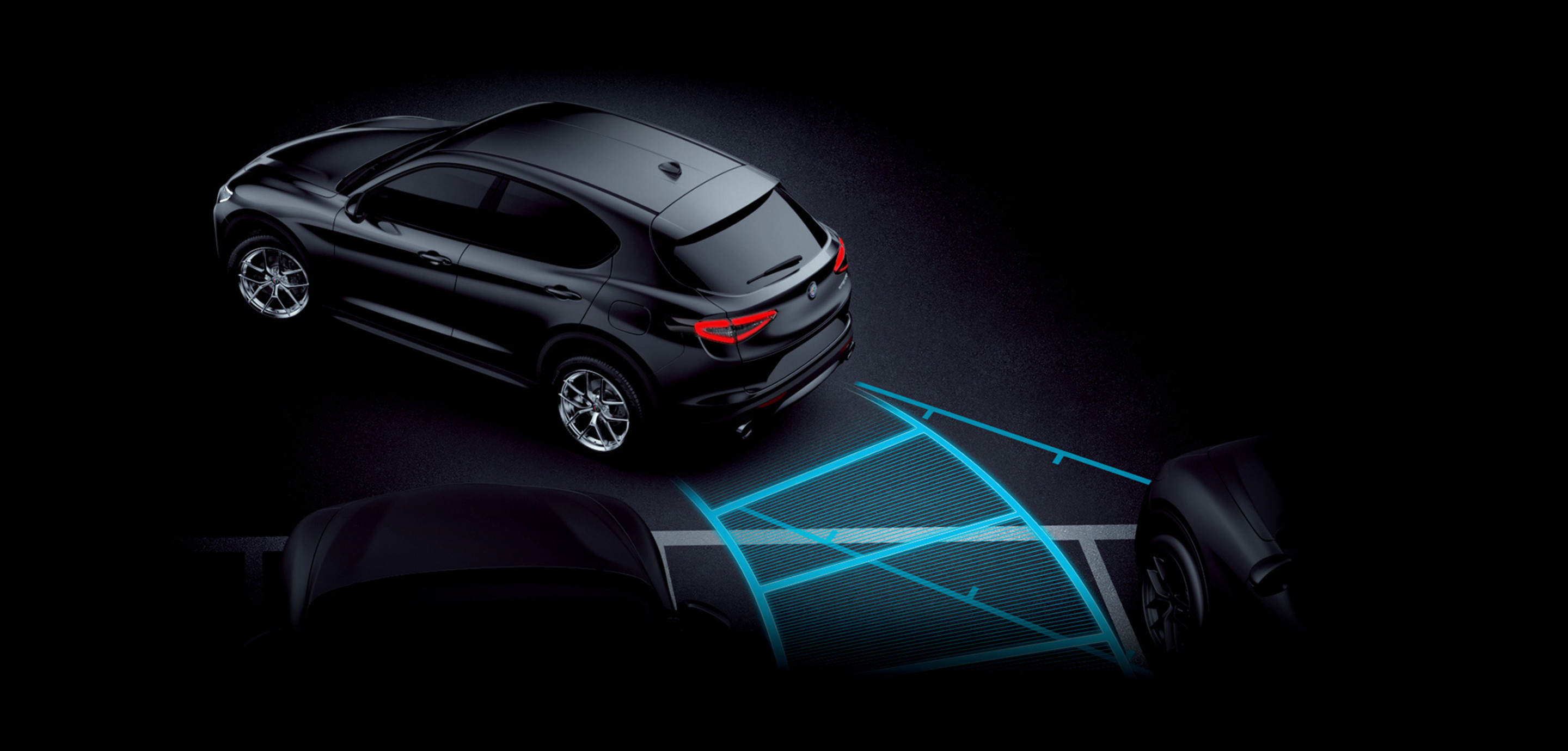 Une illustration de la caractéristique de l’aide au stationnement avant et arrière de l’Alfa Romeo Stelvio Quadrifoglio 2024.