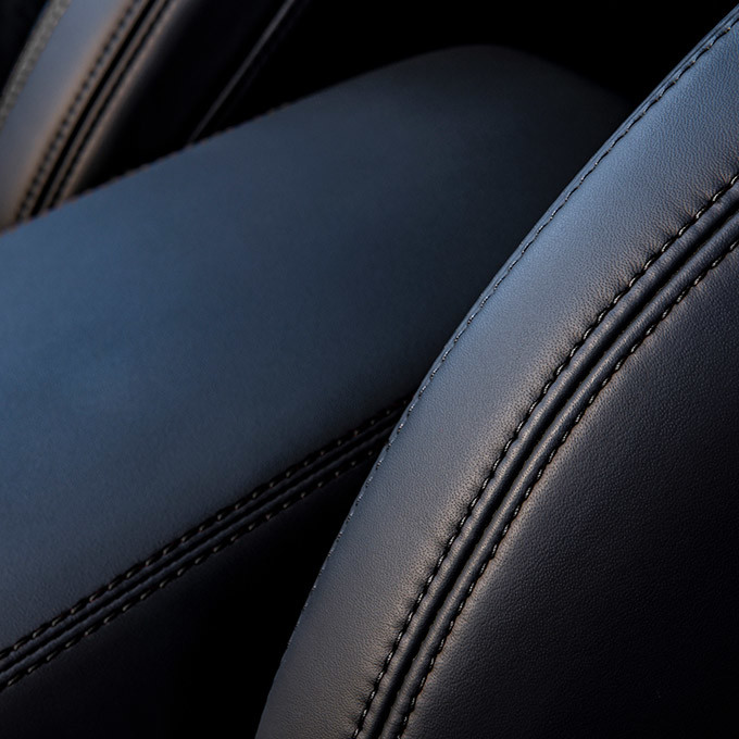 Close up of the black leather seats and black stitching