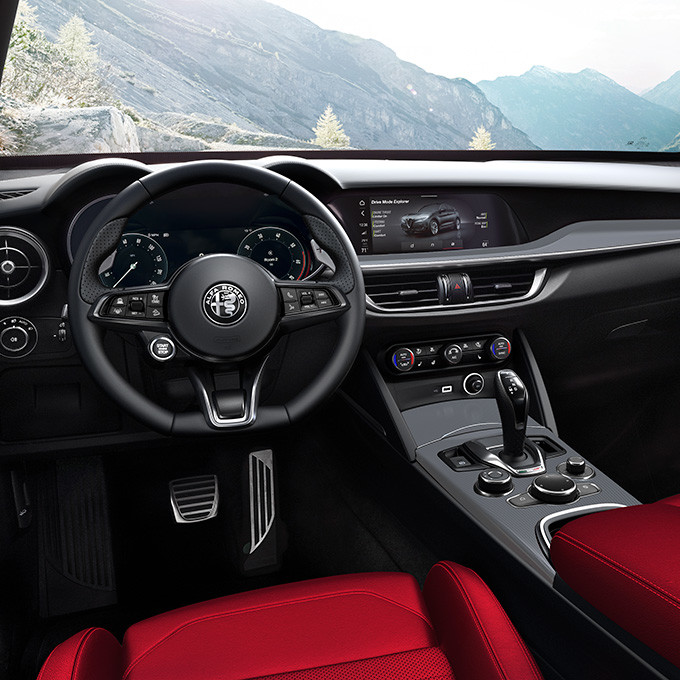 A closeup view of the 2024 Alfa Romeo Stelvio interior with infotainment system activated.