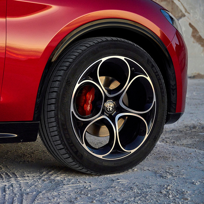 A closeup view of the wheel, tire and rim option on a 2024 Alfa Romeo Stelvio.