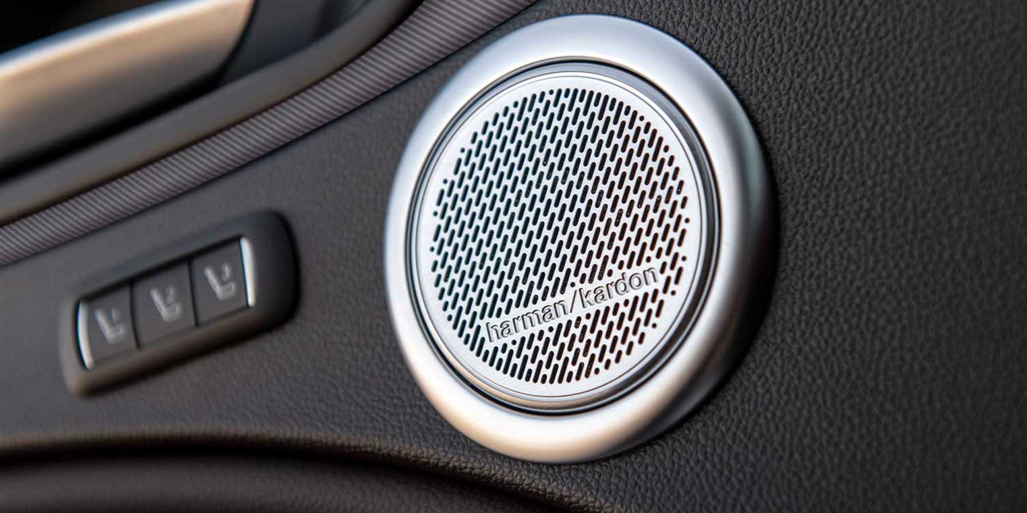 A close-up view of the Harman Kardon speakers inside a 2026 Alfa Romeo Stelvio.