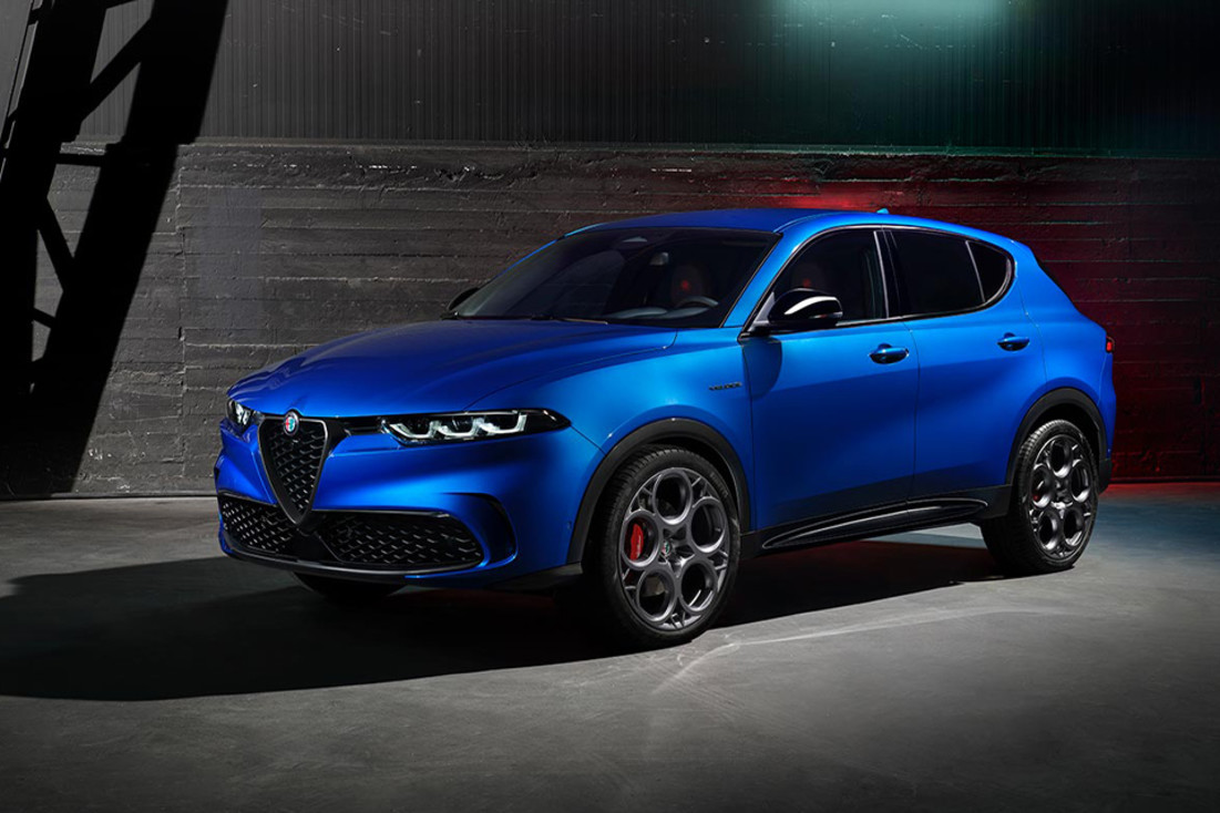 Angled view of a parked blue 2024 Alfa Romeo Tonale PHEV.