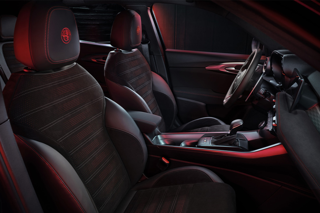 Interior image of the black leather front seating in the 2024 Alfa Romeo Tonale PHEV.