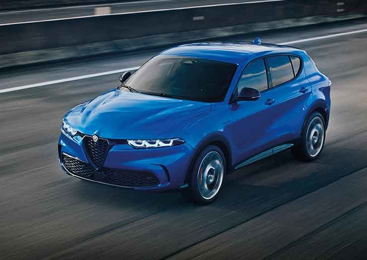 Misano Metallic Blue 2025 Alfa Romeo Tonale driving on a highway.