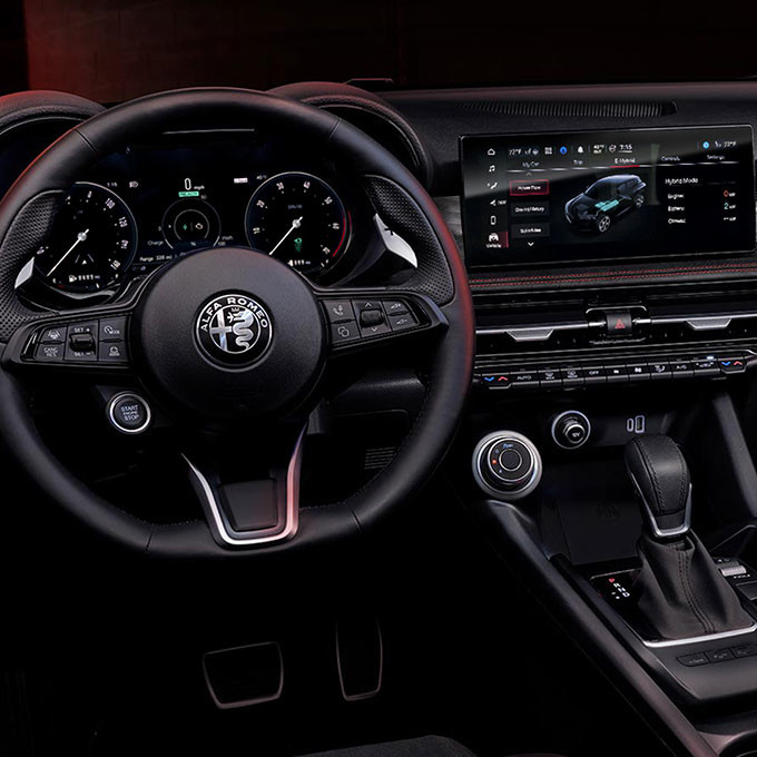 Interior of a 2025 Alfa Romeo Tonale PHEV showcasing the dashboard and digital displays.