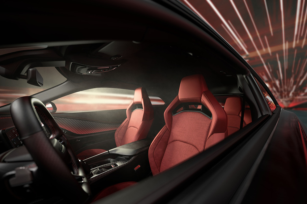 A look inside a Dodge vehicle from the exterior of the car showing the driver seat, the front passenger seat and the back rear left passenger seat.