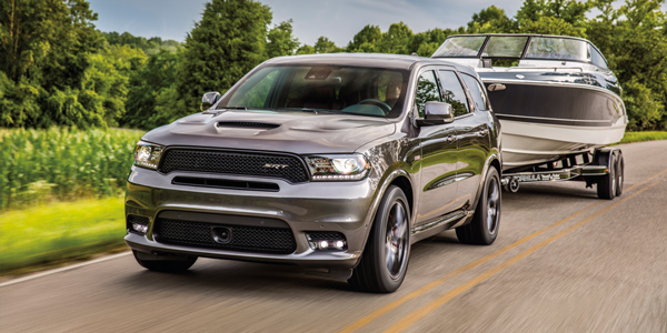 Grey 2020 Dodge Durango towing a boat 