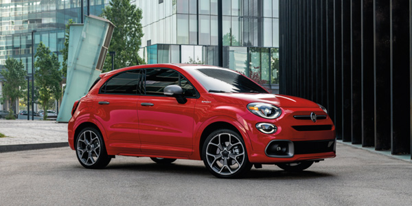 Red 2020 Fiat 500X parked in an office building lot