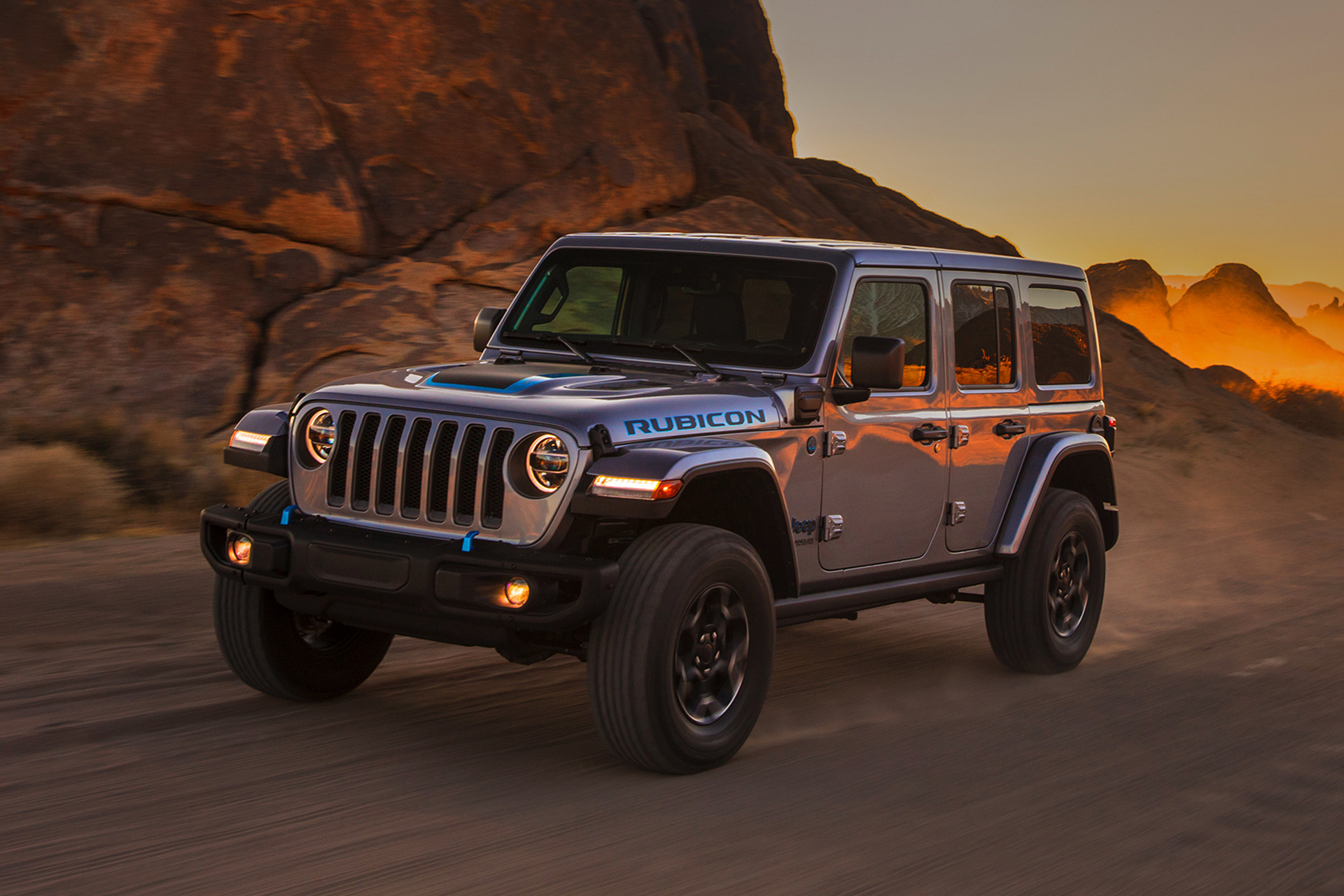  2021 Jeep Wrangler 4xe shown driven on a dirt road.