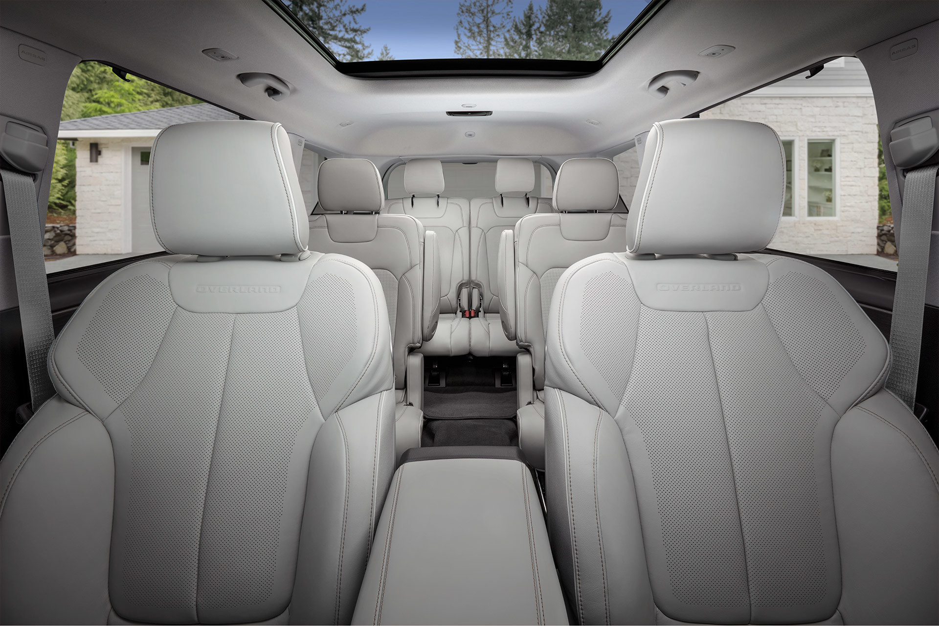 Interior shot from the front seat looking towards the back seats of the 2022 Jeep Grand Cherokee L