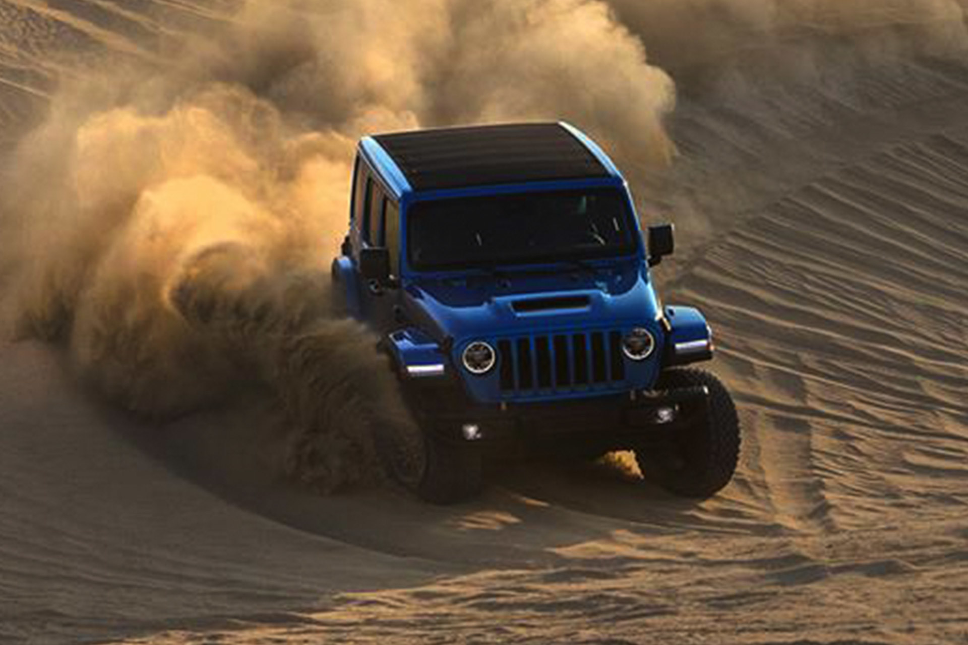 Blue Jeep Wrangler Rubicon 392 driving through the desert.