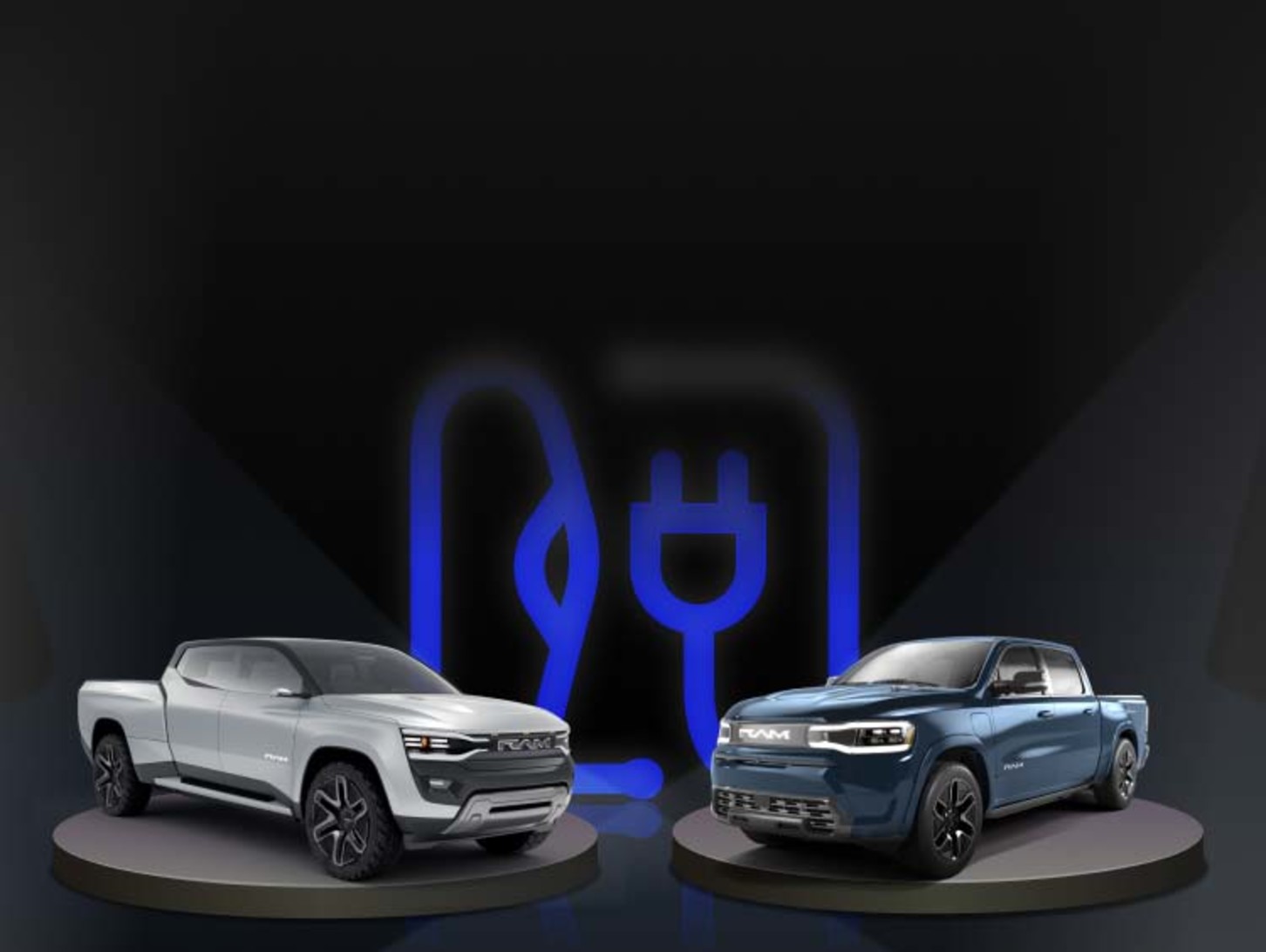 View of a Blue Ram 1500 REV and Silver Ram Revolution Concept model electric pickup truck. against a black background.