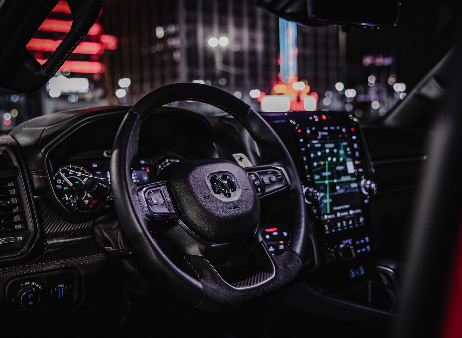 Interior of the 2022 Ram 1500 TRX showing the steering wheel and part of the dashboard.
