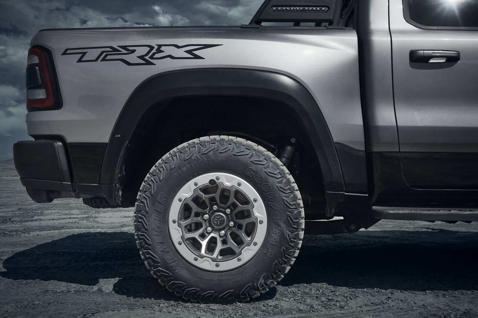 The exclusive 35-inch tires on a silver 2022 Ram 1500 TRX.