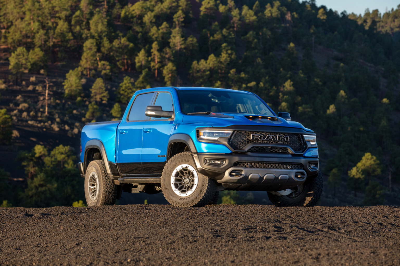 Side view of the 2022 Ram 1500 TRX in silver in the desert.