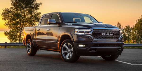 Grey 2020 Ram 1500 DT parked on an empty lot at sunset